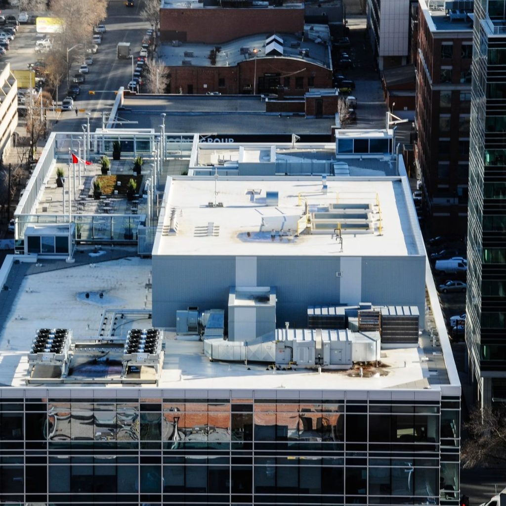 Commercial flat roofing system on a large building for roofing contractor services in Harris County, TX