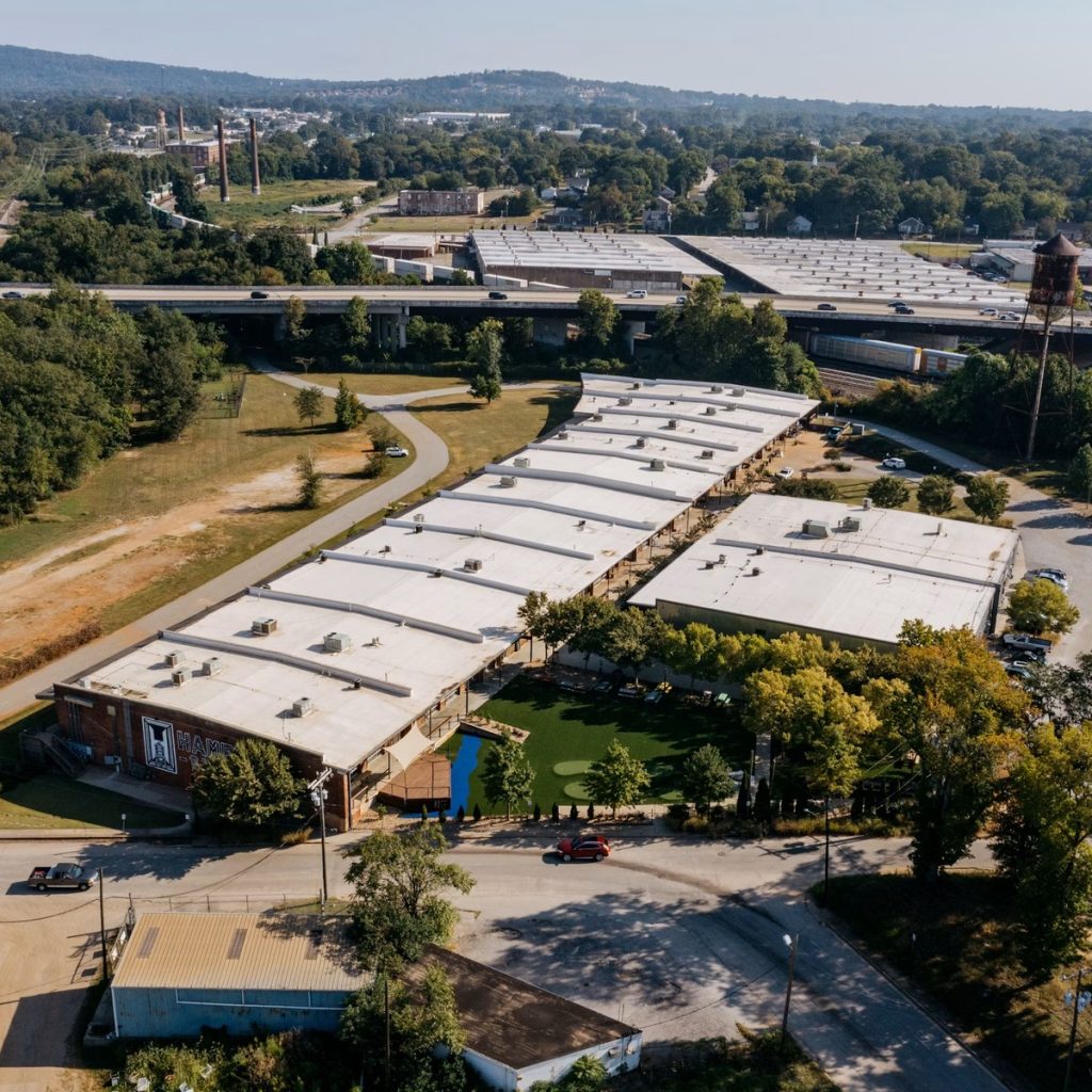 Aerial view of large commercial flat roofing systems for roofing contractor services near me
